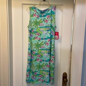 Brightly colored tropical print dress.